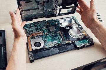 Unscrewed gaming laptop showing the motherboard (Photo credit Golubovy iStock)